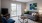 a living room with a tv and couches and a balcony door