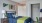 a bedroom with a bed and lamps and a closet