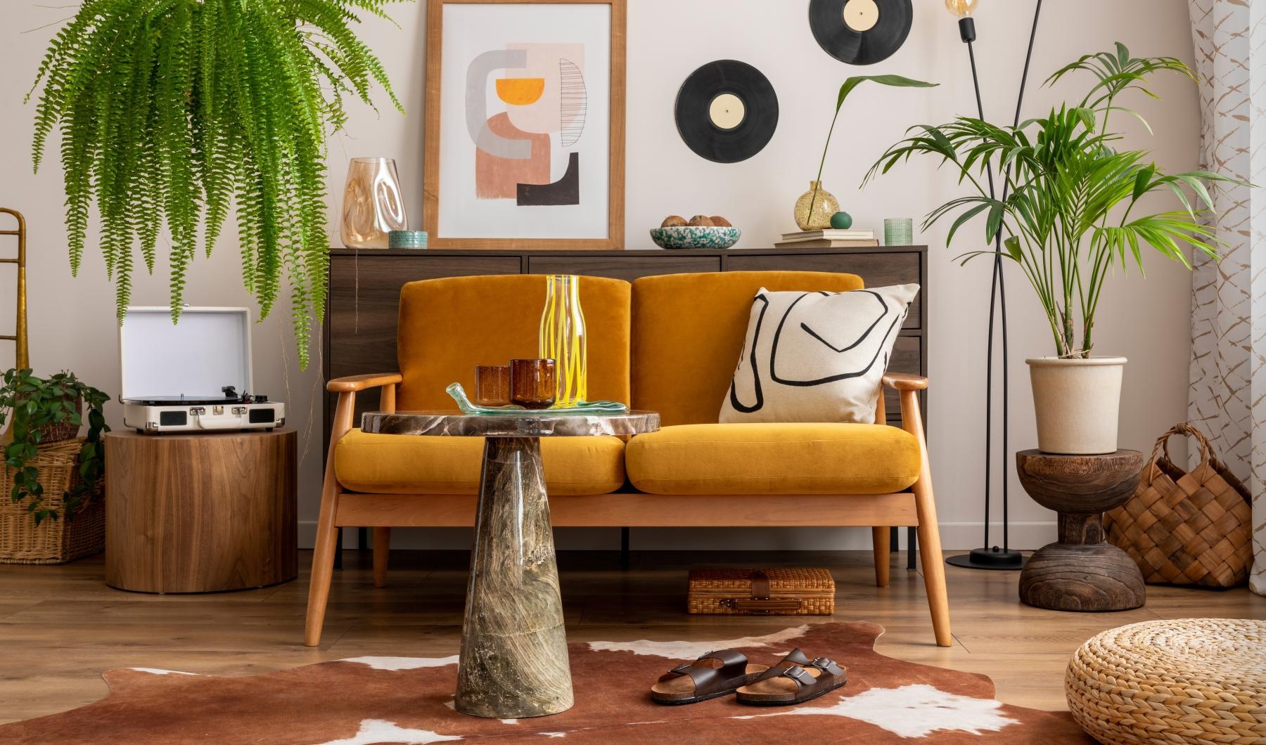Beautiful living areas to match your lifestyle a yellow couch in a room with decorations