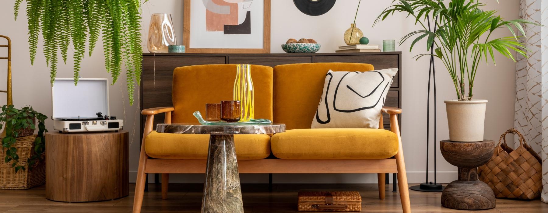 a yellow couch in a room with decorations
