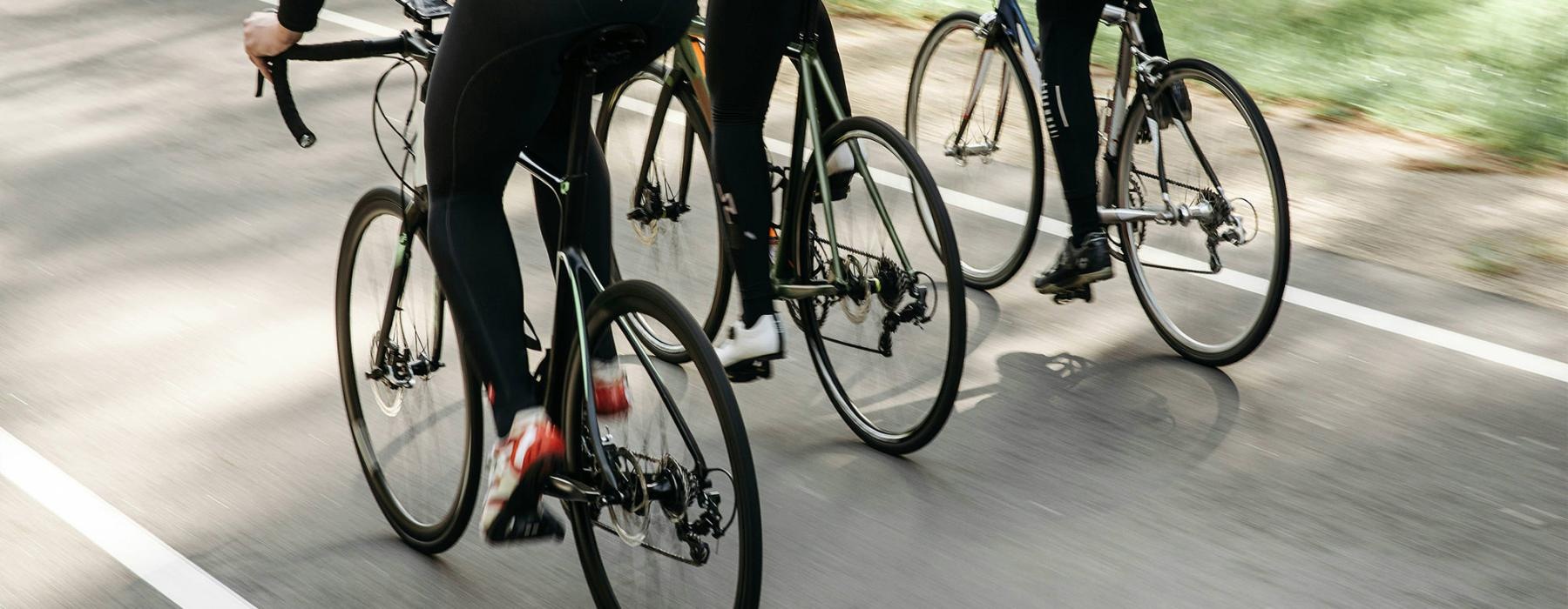 a group of people riding bikes