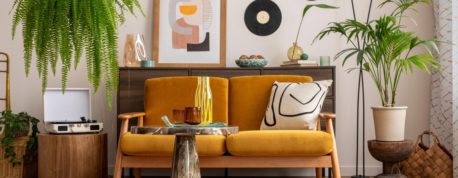 a yellow couch in a room with decorations