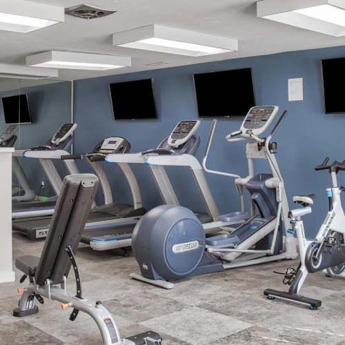 State-of-the-art amenities a gym with exercise equipment